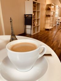 Close-up of coffee cup on table