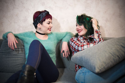 Young couple sitting in corridor