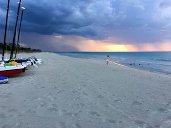 Scenic view of beach against sky during sunset