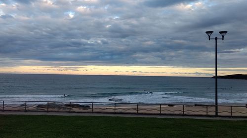 Scenic view of sea against cloudy sky