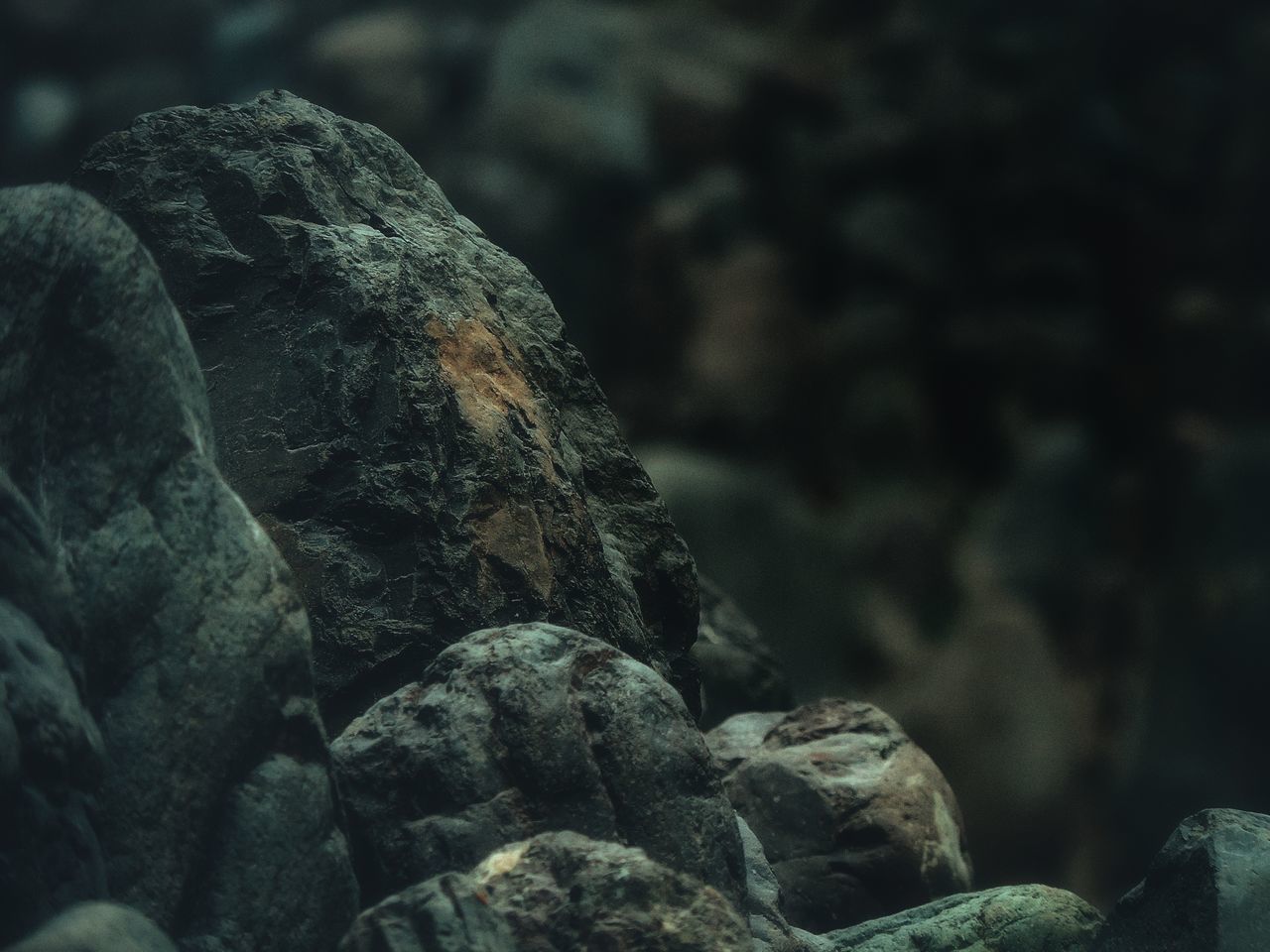 CLOSE-UP OF ROCK ON ROCKS