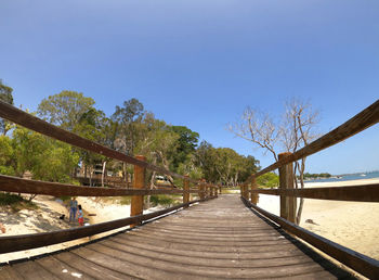 View of footbridge against clear sky