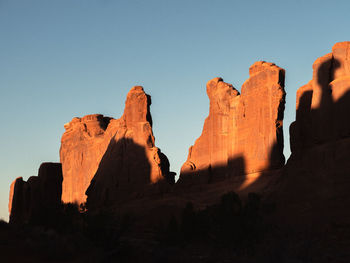Low angle view of rock formations against sky