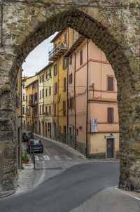 Road by buildings in city