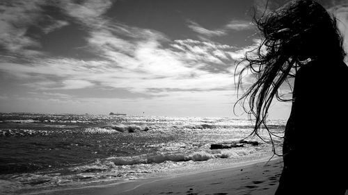 Scenic view of sea against cloudy sky