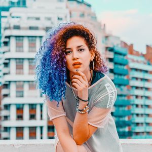 Portrait of beautiful young woman in city