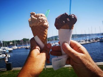 Cropped image of hand holding ice cream cone