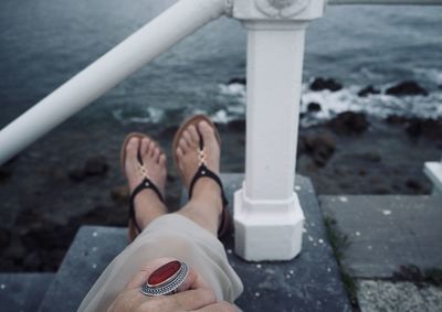 Low section of woman wearing shoes outdoors