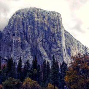 Low angle view of rocky mountains against sky