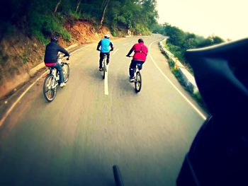 Man riding bicycle on road