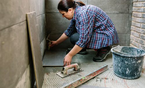 Man working on wall