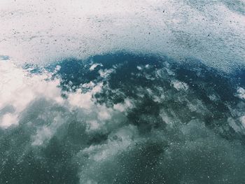 Reflection of sky on puddle