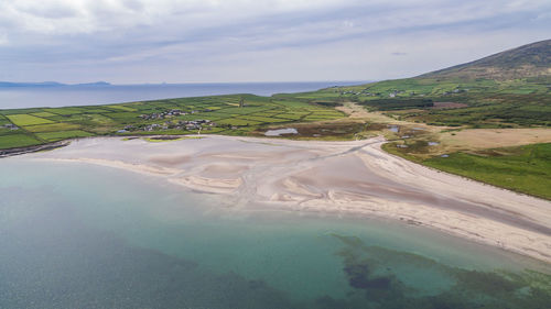 Aerial view of landscape against cloudy sky