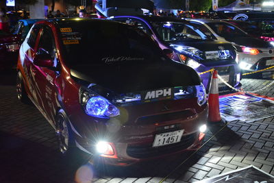 Cars on city street at night