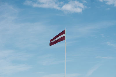 Low angle view of flag against sky