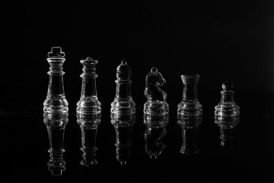 Close-up of chess pieces against black background