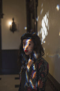 Portrait of a young woman looking away