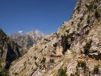 Scenic view of rocky mountains against clear sky