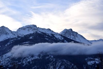 Scenic view of snowcapped mountains against sky