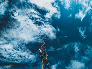 Low angle view of communications tower against sky