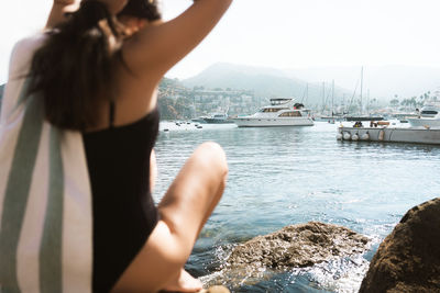 Rear view of woman looking at sea