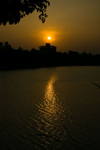 Scenic view of sea against orange sky