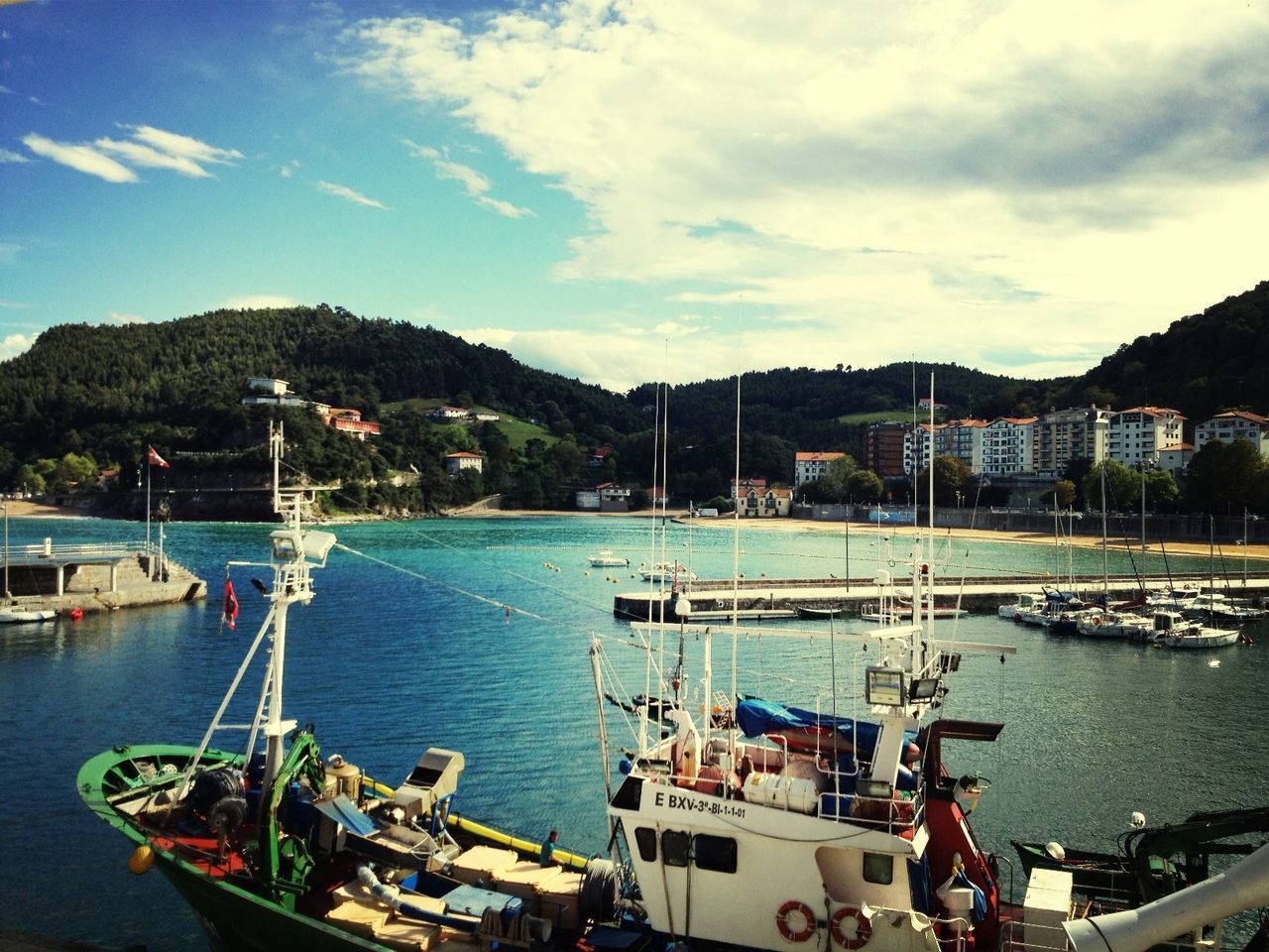 nautical vessel, transportation, mode of transport, water, sky, boat, moored, mountain, cloud - sky, built structure, building exterior, sea, architecture, harbor, cloud, nature, river, high angle view, cloudy, day