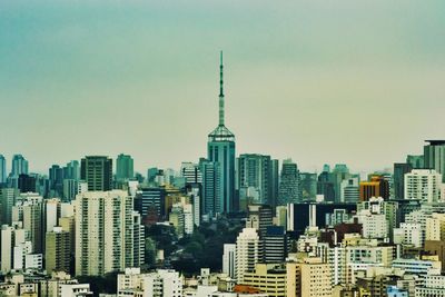 Modern buildings in city against sky