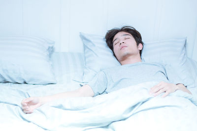 Man sleeping on bed