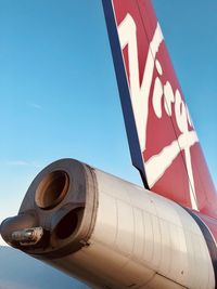 Low angle view of sign against clear blue sky