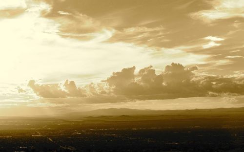 Scenic view of landscape against sky at sunset