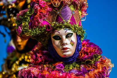 Portrait of woman with multi colored flowers