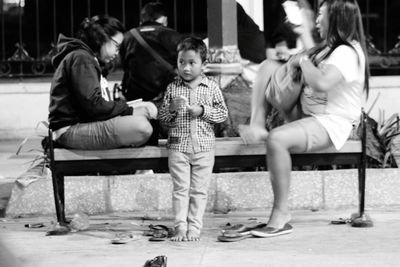 Full length of children sitting on floor