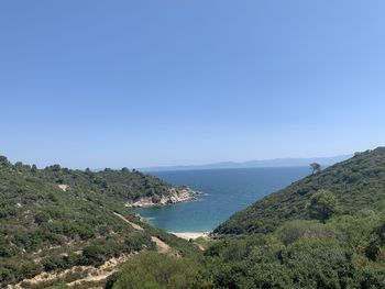 Scenic view of sea against clear blue sky