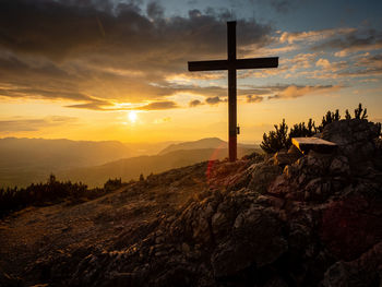 Cross against sky during sunset