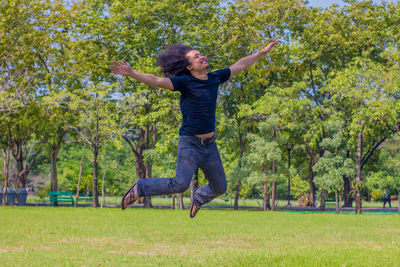 Full length of man jumping at public park