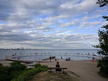 Scenic view of sea against cloudy sky