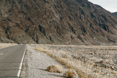 Scenic view of mountain road against sky