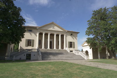 Facade of historic building against sky