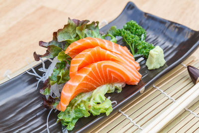 High angle view of vegetables in plate on table