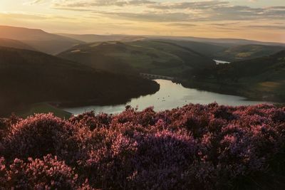 Scenic view of lake against sky during sunset
