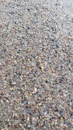 Close-up of pebbles on sand