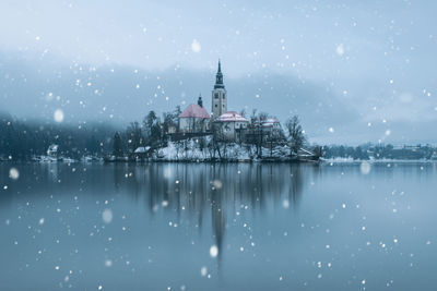 View of buildings against sky during winter