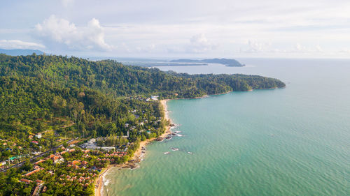 High angle view of townscape by sea against sky