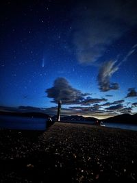 Scenic view of beach against sky at night