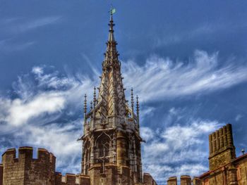 Low angle view of church against cloudy sky