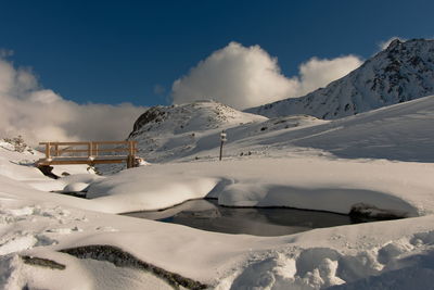 Snow covered mountain against sky