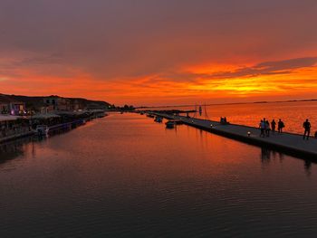 Scenic view of sea against orange sky