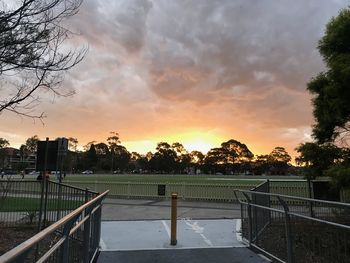 View of soccer field against sky during sunset