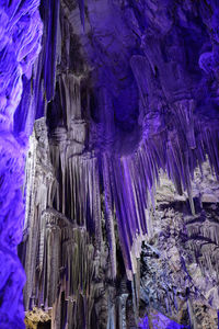 Low angle view of icicles on rock formation